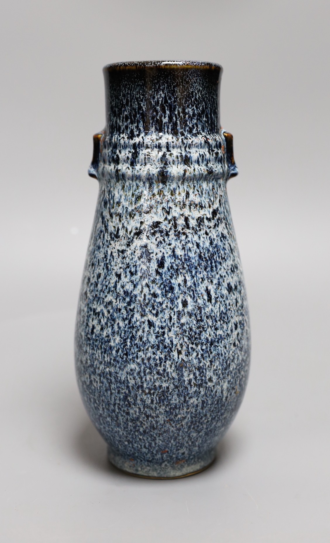 A Chinese Shiwan vase, 23 cms high